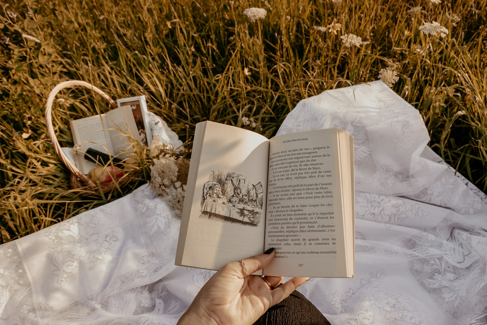 person holding white book page